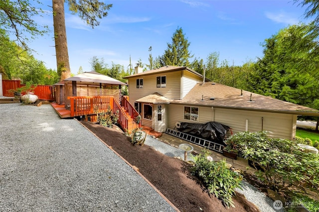 163 Polo Park Dr, Bellingham, WA 98229 - view of front of property with a deck, a gazebo, and a chimney