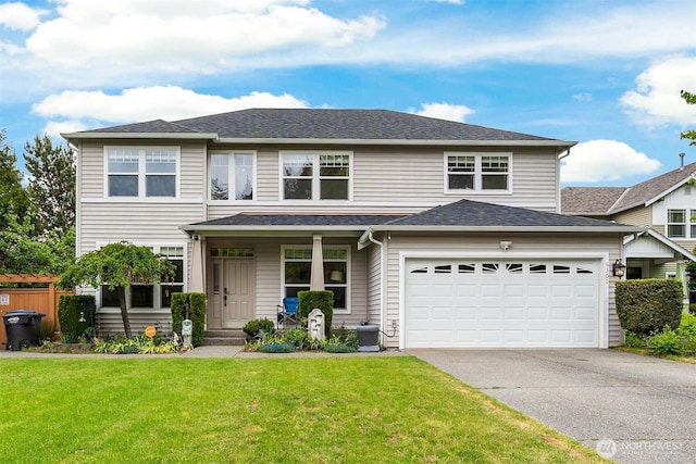 view of front of house with driveway, a front yard, a porch, a garage, and cooling unit