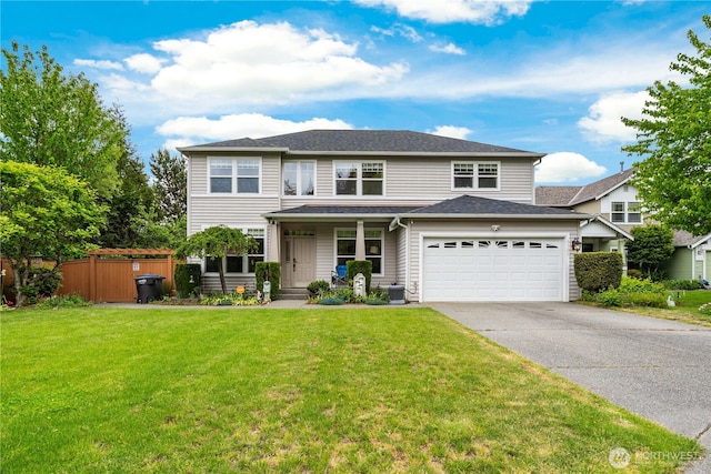 traditional-style home featuring concrete driveway, an attached garage, covered porch, and roof with shingles