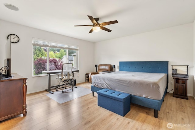 bedroom featuring light wood-type flooring, baseboards, and a ceiling fan