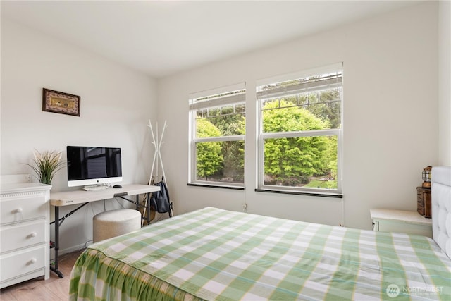 bedroom featuring light wood-style floors