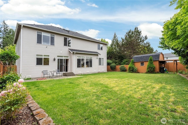 rear view of property with a storage shed, a patio, an outdoor structure, and entry steps