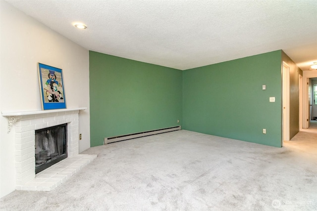 7308 N Skyview Ln Unit I-204, Tacoma, WA 98406 - unfurnished living room with a baseboard heating unit, carpet, a fireplace, and a textured ceiling