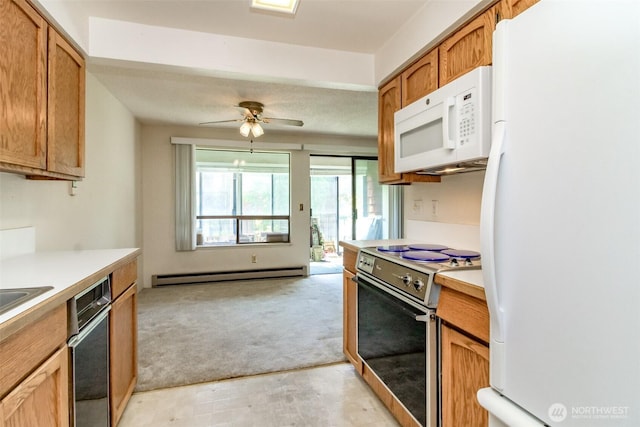 7308 N Skyview Ln Unit I-204, Tacoma, WA 98406 - kitchen with white appliances, a baseboard radiator, light countertops, light colored carpet, and ceiling fan