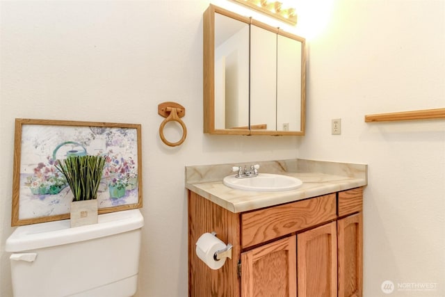 7308 N Skyview Ln Unit I-204, Tacoma, WA 98406 - half bathroom featuring vanity and toilet