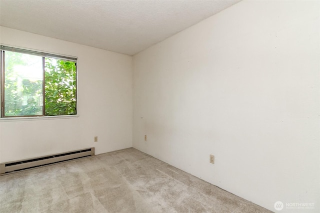 7308 N Skyview Ln Unit I-204, Tacoma, WA 98406 - unfurnished room with light colored carpet and baseboard heating