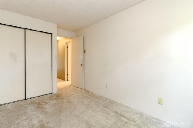 7308 N Skyview Ln Unit I-204, Tacoma, WA 98406 - unfurnished bedroom with carpet floors and a closet