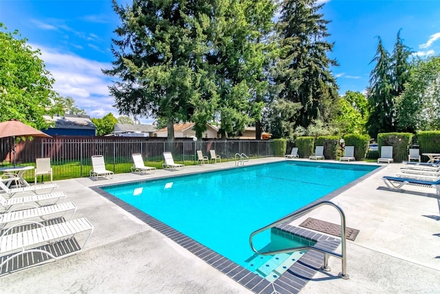 7308 N Skyview Ln Unit I-204, Tacoma, WA 98406 - community pool featuring a patio area and fence