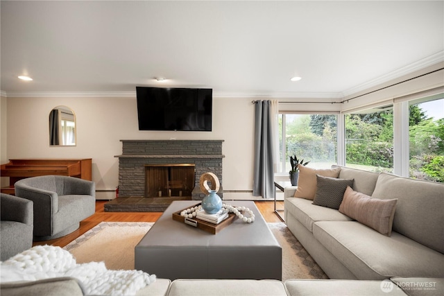 11411 Clovercrest Dr SW, Lakewood, WA 98499 - living room featuring healthy amount of natural light, baseboard heating, ornamental molding, recessed lighting, and wood finished floors