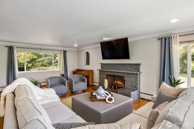 11411 Clovercrest Dr SW, Lakewood, WA 98499 - living room featuring a baseboard radiator, wood finished floors, a fireplace, crown molding, and recessed lighting