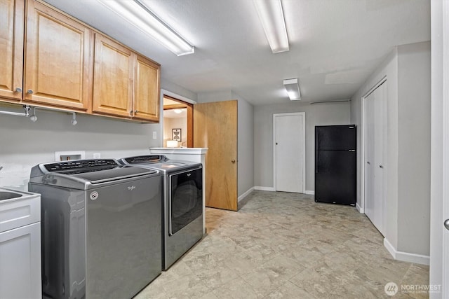 11411 Clovercrest Dr SW, Lakewood, WA 98499 - clothes washing area featuring cabinet space, washer and dryer, and baseboards