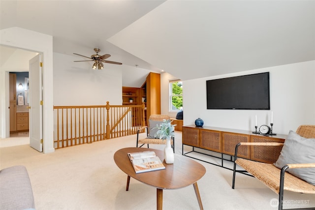 carpeted living room featuring lofted ceiling and ceiling fan