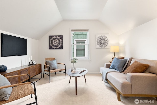 living room with vaulted ceiling and light colored carpet