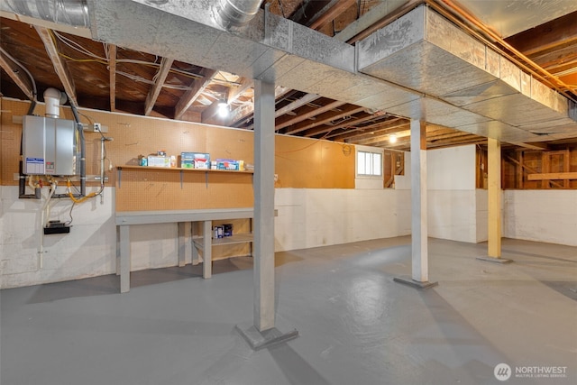 below grade area featuring water heater