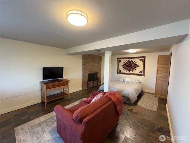 10644 19th Ave SW, Seattle, WA 98146 - living area with baseboards, a brick fireplace, stone finish floors, and a textured ceiling