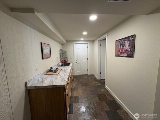 10644 19th Ave SW, Seattle, WA 98146 - bar with baseboards, stone tile floors, and recessed lighting