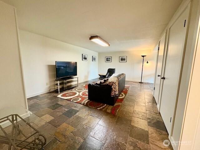 10644 19th Ave SW, Seattle, WA 98146 - living area with stone tile floors and baseboards