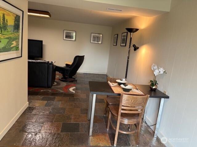 10644 19th Ave SW, Seattle, WA 98146 - office with baseboards and stone finish flooring