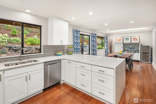 6700 81st Ave SE, Mercer Island, WA 98040 - kitchen with dishwasher, a sink, a peninsula, beverage cooler, and tasteful backsplash