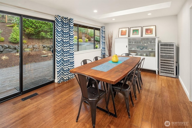 6700 81st Ave SE, Mercer Island, WA 98040 - dining area featuring beverage cooler, wood finished floors, a skylight, recessed lighting, and baseboards