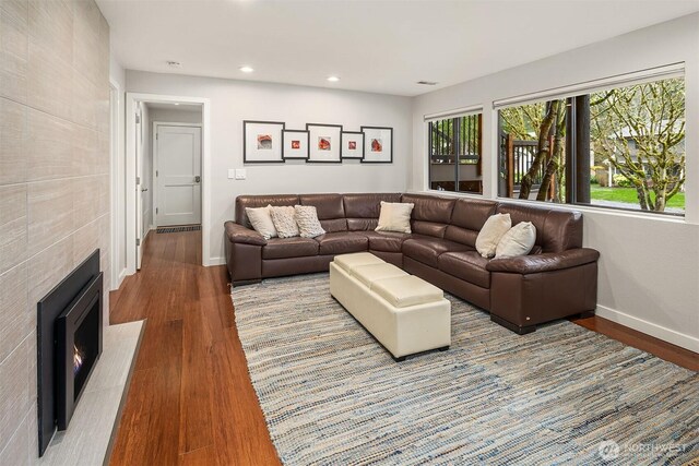 6700 81st Ave SE, Mercer Island, WA 98040 - living room with baseboards, wood finished floors, a tiled fireplace, and recessed lighting