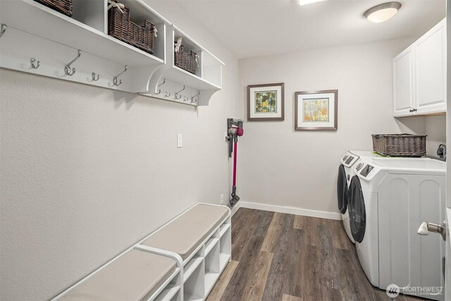 6700 81st Ave SE, Mercer Island, WA 98040 - clothes washing area with washing machine and dryer, cabinet space, dark wood finished floors, and baseboards