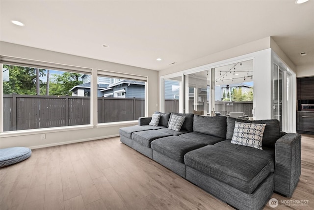 24821 237th Ln SE, Maple Valley, WA 98038 - living room with healthy amount of natural light, wood finished floors, recessed lighting, and baseboards