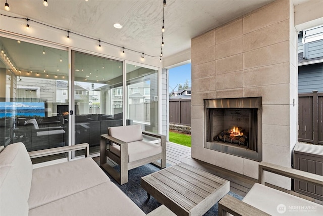 24821 237th Ln SE, Maple Valley, WA 98038 - living room featuring a fireplace and rail lighting