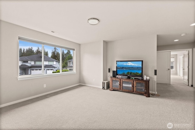 24821 237th Ln SE, Maple Valley, WA 98038 - unfurnished living room featuring carpet floors and baseboards