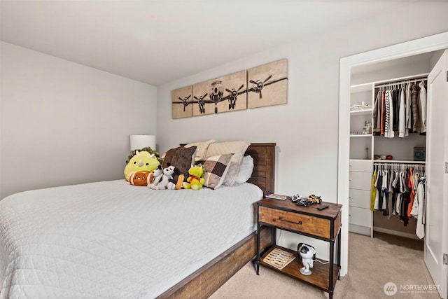 24821 237th Ln SE, Maple Valley, WA 98038 - bedroom featuring a walk in closet, carpet flooring, a closet, and baseboards