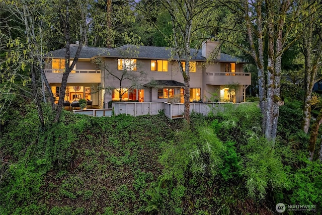 5310 W Mercer Way, Mercer Island, WA 98040 - rear view of house featuring a balcony and a chimney