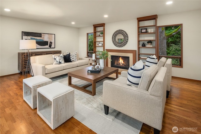 5310 W Mercer Way, Mercer Island, WA 98040 - living area with wood finished floors, a lit fireplace, and recessed lighting