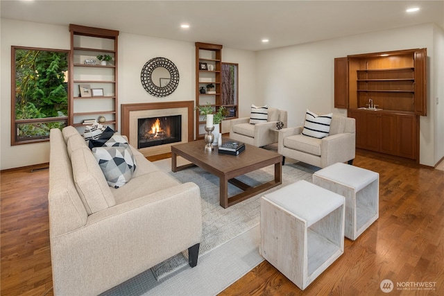 5310 W Mercer Way, Mercer Island, WA 98040 - living area featuring wood finished floors, recessed lighting, and a fireplace with flush hearth