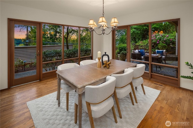 5310 W Mercer Way, Mercer Island, WA 98040 - dining room featuring a chandelier and light wood-type flooring
