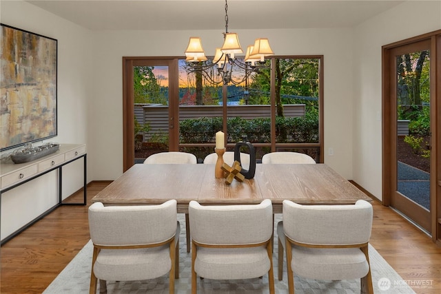 5310 W Mercer Way, Mercer Island, WA 98040 - dining area with a chandelier, plenty of natural light, and wood finished floors