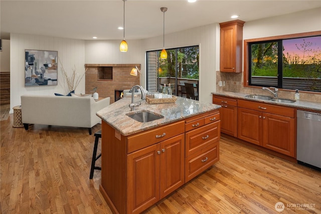 5310 W Mercer Way, Mercer Island, WA 98040 - kitchen featuring a sink, stainless steel dishwasher, brown cabinetry, and recessed lighting