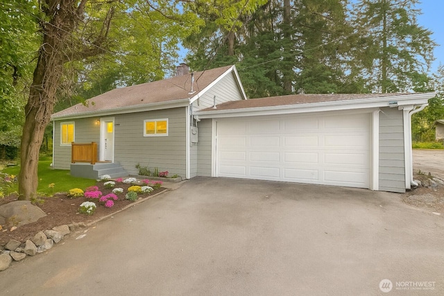 35603 Military Rd S, Auburn, WA 98001 - view of front of home featuring asphalt driveway and a garage