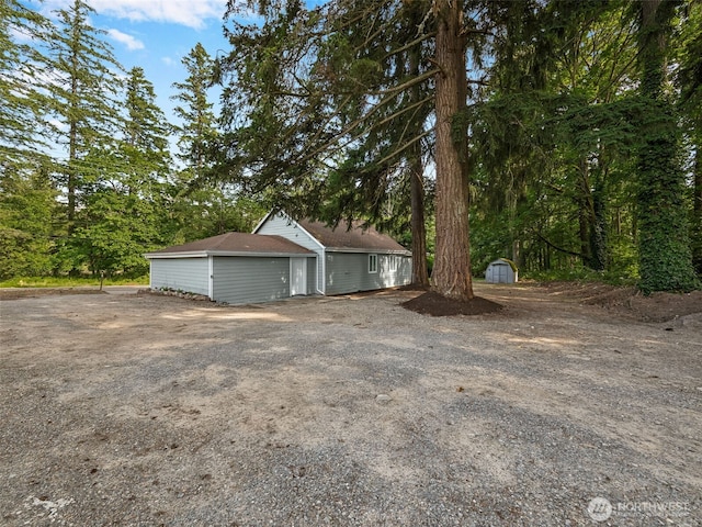 35603 Military Rd S, Auburn, WA 98001 - view of front facade with a storage unit and a garage