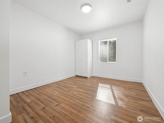 35603 Military Rd S, Auburn, WA 98001 - spare room featuring baseboards and light wood-type flooring