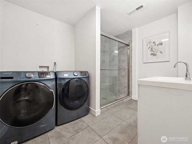 35603 Military Rd S, Auburn, WA 98001 - washroom with independent washer and dryer and light tile patterned flooring