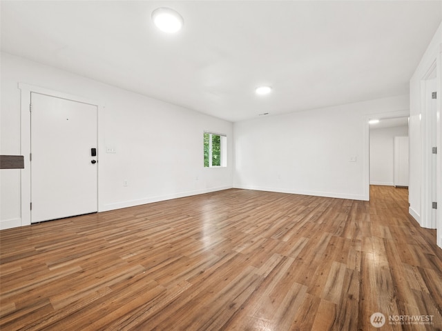 35603 Military Rd S, Auburn, WA 98001 - unfurnished living room with light wood finished floors and baseboards