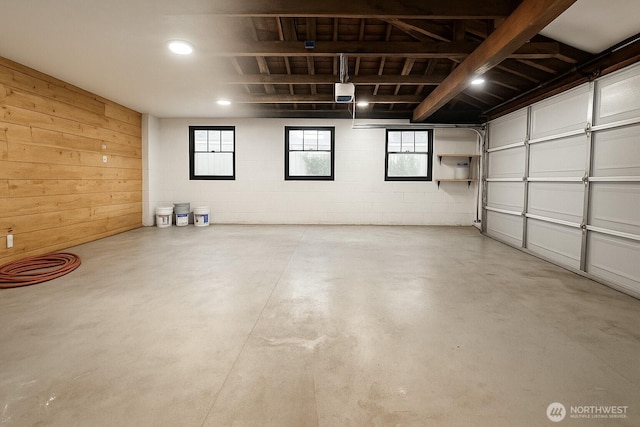 35603 Military Rd S, Auburn, WA 98001 - garage featuring a garage door opener and concrete block wall
