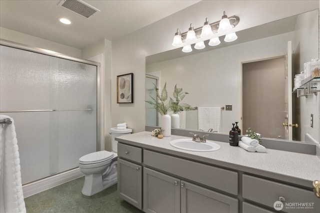 full bath with a shower stall, toilet, and vanity