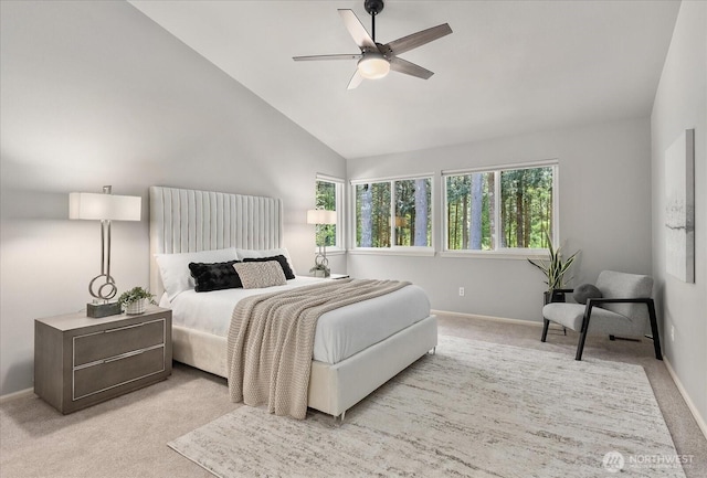 bedroom with carpet floors, baseboards, vaulted ceiling, and ceiling fan
