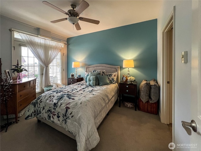 carpeted bedroom with a ceiling fan and access to exterior