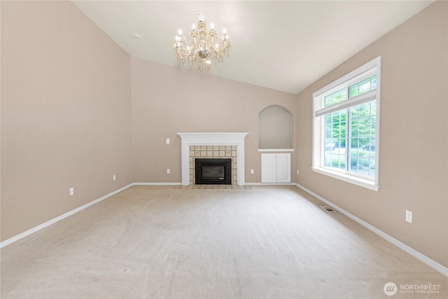2222 60th Ln NW, Olympia, WA 98502 - unfurnished living room featuring a chandelier, baseboards, a fireplace, lofted ceiling, and light colored carpet