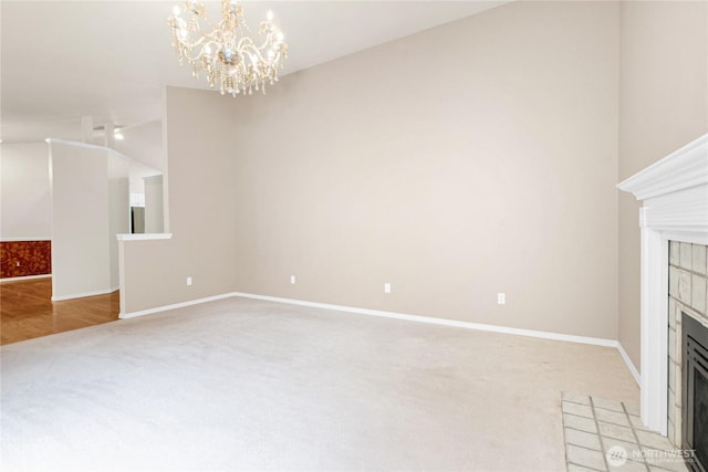 2222 60th Ln NW, Olympia, WA 98502 - unfurnished living room with light carpet, a tile fireplace, vaulted ceiling, a chandelier, and baseboards