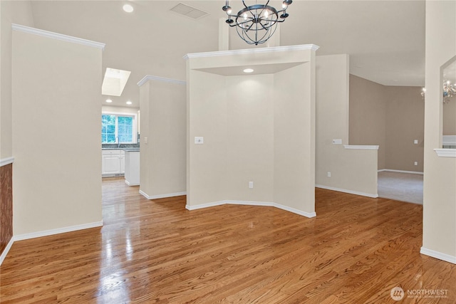 2222 60th Ln NW, Olympia, WA 98502 - empty room with a chandelier, wood finished floors, baseboards, and a skylight