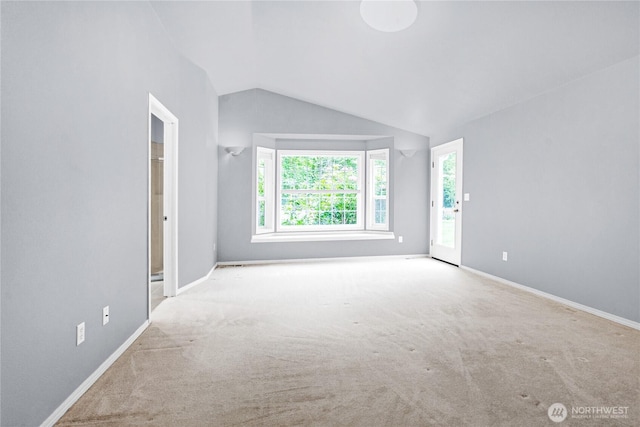 2222 60th Ln NW, Olympia, WA 98502 - unfurnished living room with vaulted ceiling, carpet, and baseboards