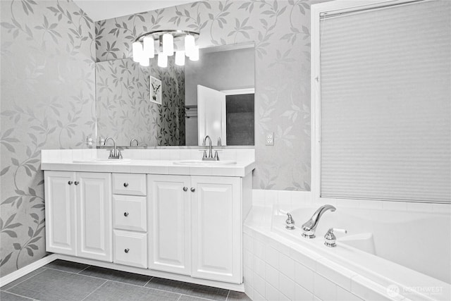 2222 60th Ln NW, Olympia, WA 98502 - bathroom featuring wallpapered walls, double vanity, tile patterned floors, a garden tub, and baseboards